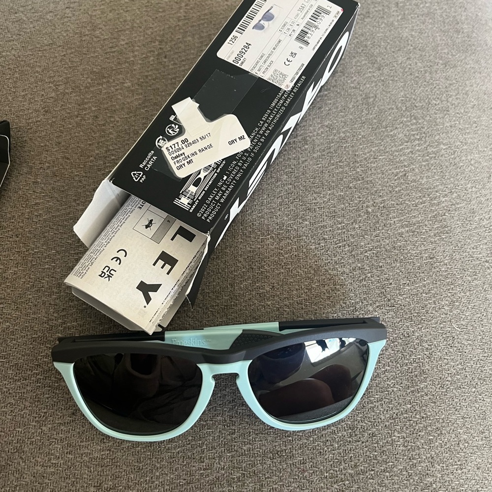 Youth size Oakley Frogskins,brand new,open box with tags,eyewear leash included.